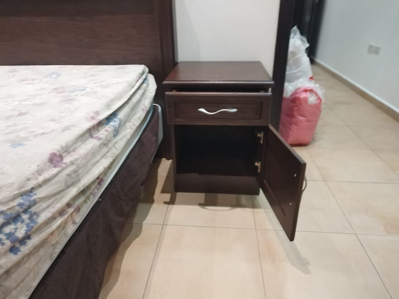 A premium full bedroom furniture set featuring a rich natural wood oak finish, including a clean-lined bedframe with an integrated headboard, two matching minimalist nightstands, a spacious multi-drawer dresser, and a large matching wardrobe closet. - Photo 5