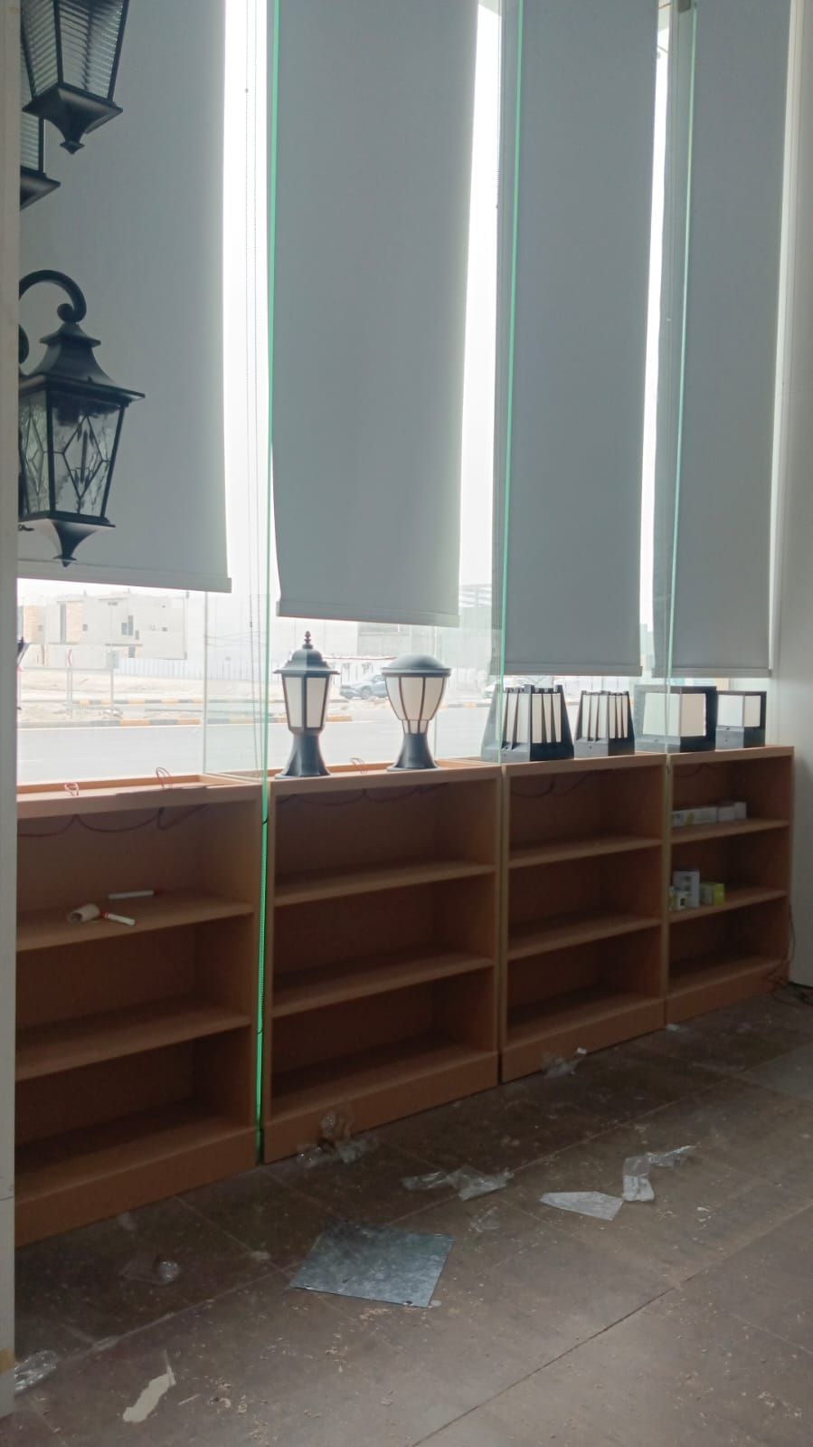 A commercial retail display set featuring wall-mounted slatwall panels with insertion grooves alongside coordinating square modular storage cabinets. - Photo 2