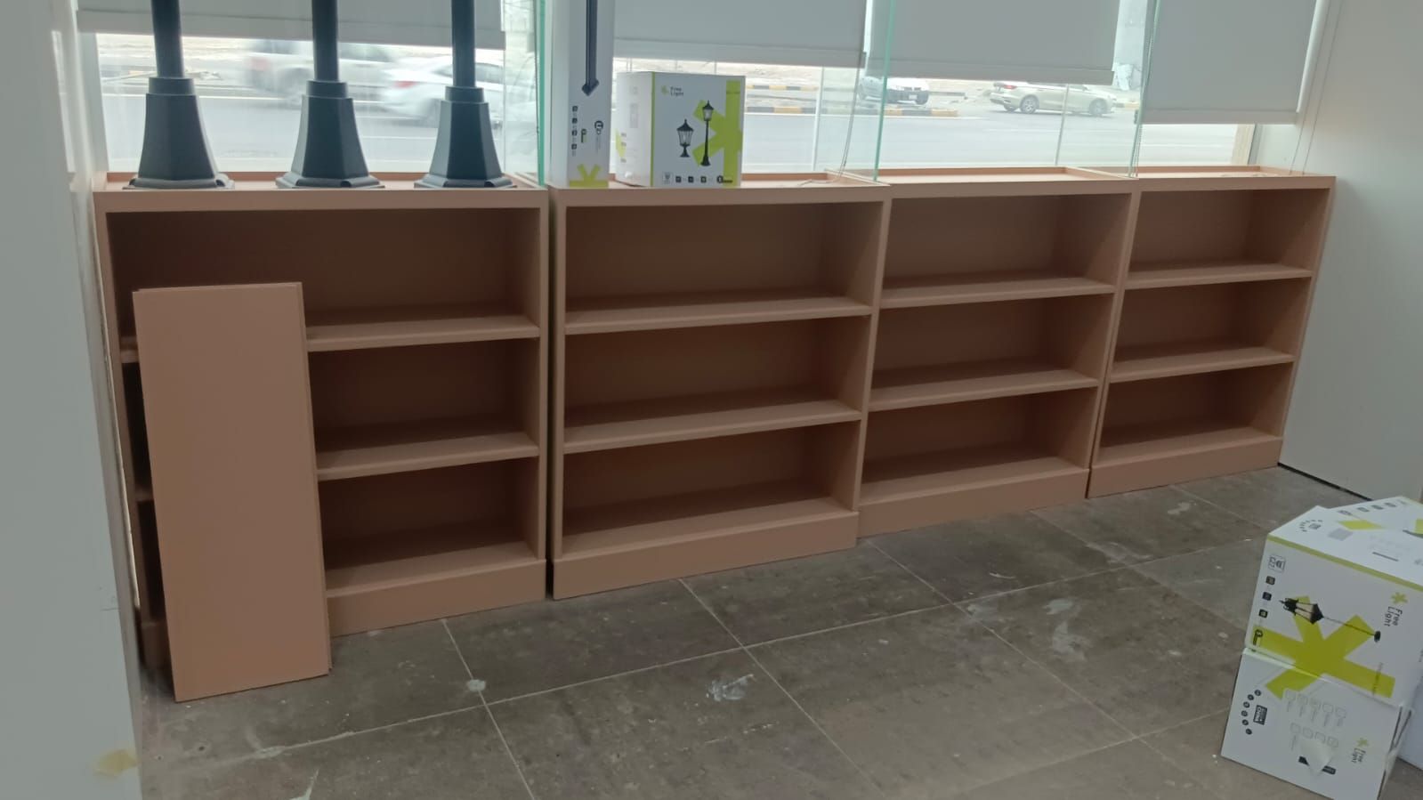 A commercial retail display set featuring wall-mounted slatwall panels with insertion grooves alongside coordinating square modular storage cabinets. - Photo 3