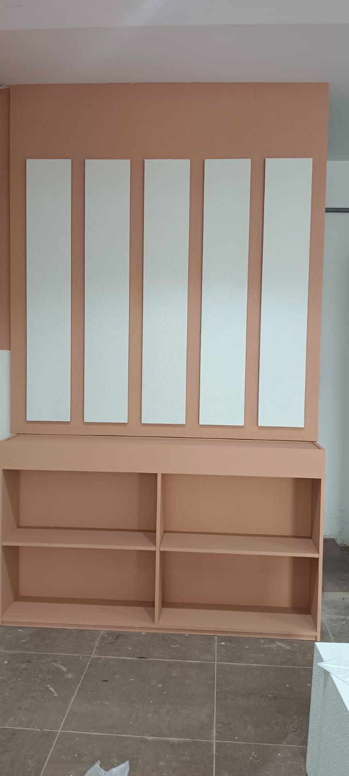 A commercial retail display set featuring wall-mounted slatwall panels with insertion grooves alongside coordinating square modular storage cabinets. - Photo 5