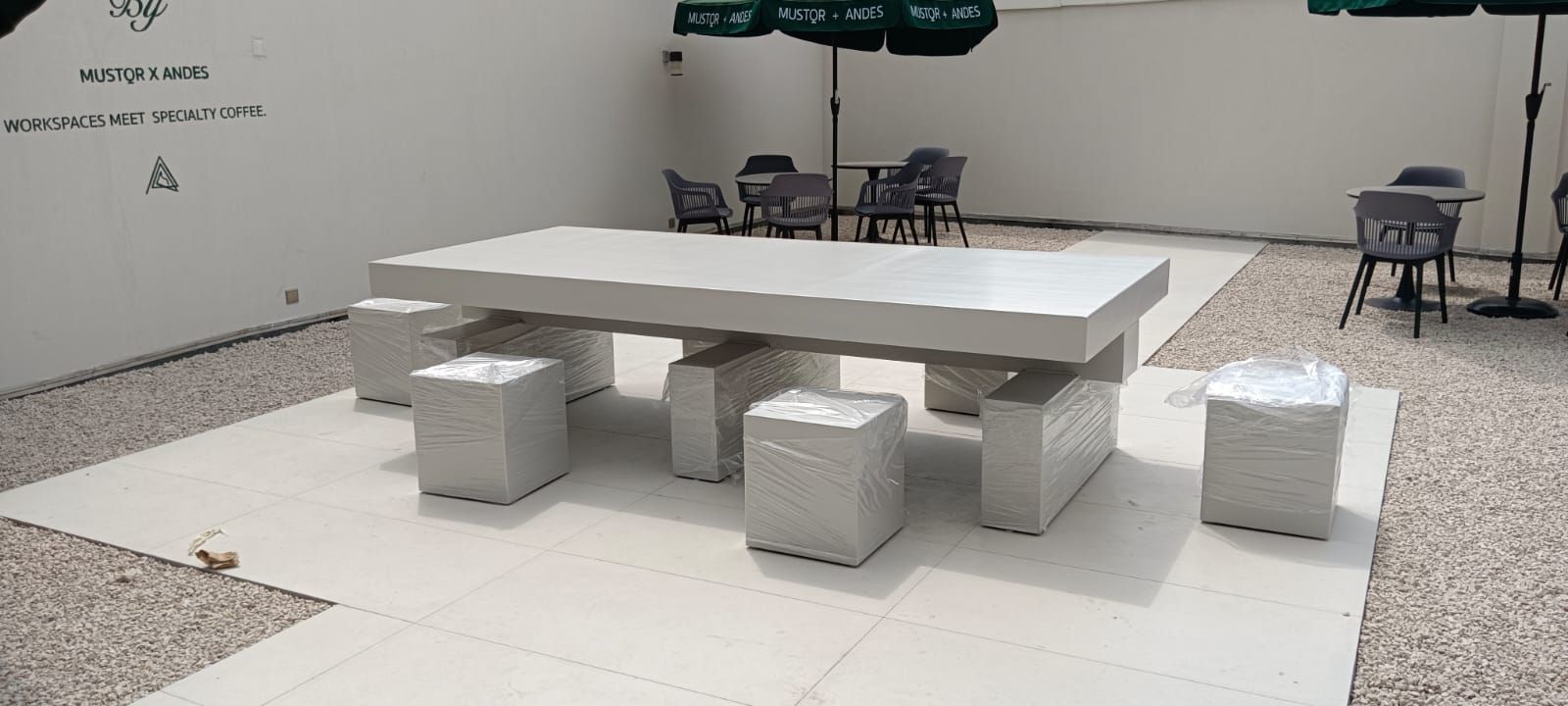 A commercial-grade restaurant dining unit combining integrated wooden bench seating with a matching central dining table. - Photo 1